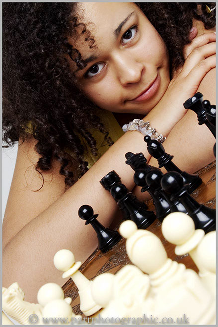 Studio Portrait of a girl and chess board