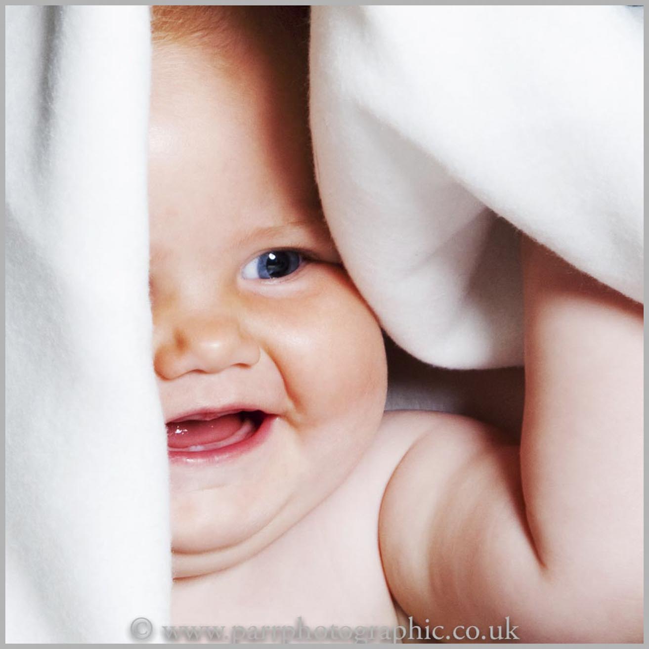 Studio Portrait of a baby and a towel