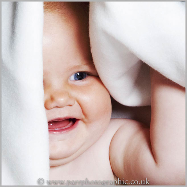 Studio Portrait of a baby and a towel