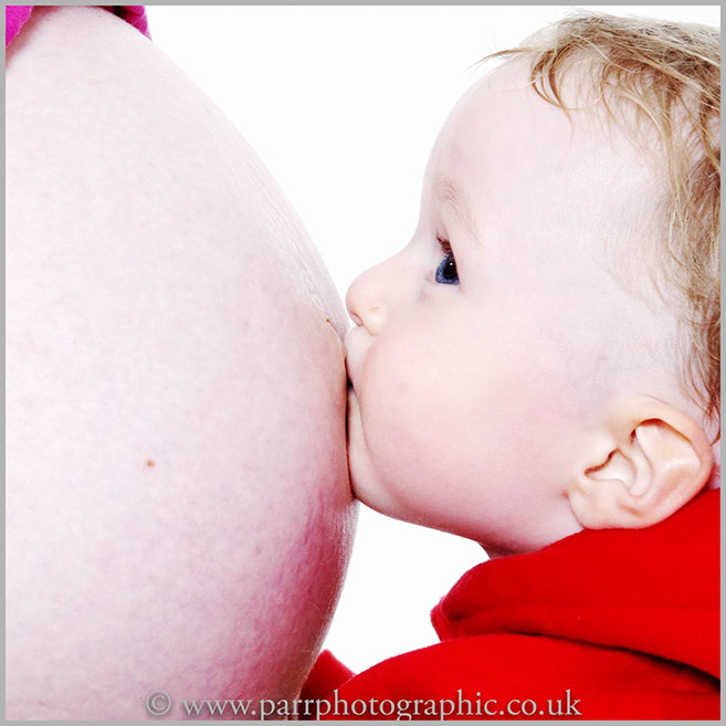 Studio Portrait of mother bump and child 