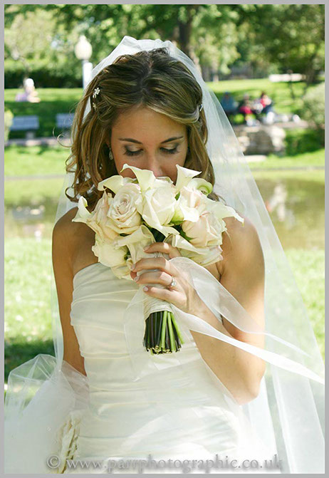 Bride smells her flowers in Devon