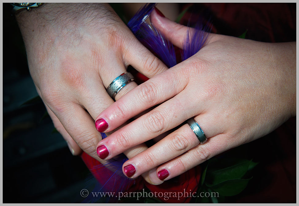 Bride and Grooms hands showing the wedding rings